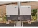 Close-up of dual solar panel components featuring a Sunny Boy inverter system for energy efficiency at 28706 102Nd E Dr, Myakka City, FL 34251
