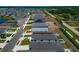 Wide angle aerial shot showing neighborhood, nearby roads, home's solar panels, fence and yard at 2969 Great Abaco Way, Bradenton, FL 34208