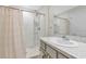 Bathroom boasts double sinks, stone counters, generous storage, shower, and neutral color palette, and excellent lighting at 2969 Great Abaco Way, Bradenton, FL 34208