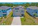 Inviting two-story home with a well-kept lawn, long driveway, an attached garage, and covered porch at 2969 Great Abaco Way, Bradenton, FL 34208