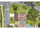 Aerial view of a home highlighting the roof, landscaping, pool, and surrounding neighborhood at 3698 Glen Oaks Manor Dr, Sarasota, FL 34232