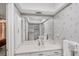 Bathroom with white vanity and a large mirror at 3698 Glen Oaks Manor Dr, Sarasota, FL 34232