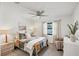 Bedroom features a ceiling fan and neutral décor at 3698 Glen Oaks Manor Dr, Sarasota, FL 34232
