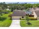 Well maintained single-story home with mature landscaping and a screened-in pool at 3698 Glen Oaks Manor Dr, Sarasota, FL 34232