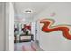 Welcoming foyer with mirrored wall, artistic mural, and decorative accents at 3698 Glen Oaks Manor Dr, Sarasota, FL 34232