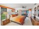 Bright bedroom with a sliding door leading to a screened outdoor patio at 3698 Glen Oaks Manor Dr, Sarasota, FL 34232
