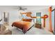 This main bedroom features a king bed, modern ceiling fan, and a colorful mural on the wall at 3698 Glen Oaks Manor Dr, Sarasota, FL 34232