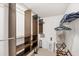 Walk-in closet with custom wood shelves and ample storage space for clothing and accessories at 3698 Glen Oaks Manor Dr, Sarasota, FL 34232