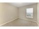 Bedroom with carpet flooring, neutral paint, and natural light from the window at 4031 Cottage Hill Ave, Parrish, FL 34219