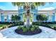 Inviting clubhouse entrance with mature landscaping and a roundabout at 4031 Cottage Hill Ave, Parrish, FL 34219