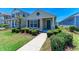 Inviting single-story home with a tidy lawn, trimmed bushes, and a quaint entryway, offering curb appeal at 4031 Cottage Hill Ave, Parrish, FL 34219