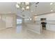 Open concept kitchen features a breakfast bar and tile flooring at 4031 Cottage Hill Ave, Parrish, FL 34219