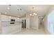 Bright kitchen features stainless appliances, pendant lights and bar seating at 4031 Cottage Hill Ave, Parrish, FL 34219