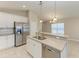 Modern kitchen features white cabinets and stainless steel appliances at 4031 Cottage Hill Ave, Parrish, FL 34219