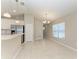 Bright kitchen features stainless appliances, pendant lights and bar seating at 4031 Cottage Hill Ave, Parrish, FL 34219