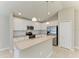 Modern kitchen features white cabinets and stainless steel appliances at 4031 Cottage Hill Ave, Parrish, FL 34219