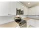 Modern kitchen featuring stainless steel appliances and white subway tile at 4031 Cottage Hill Ave, Parrish, FL 34219