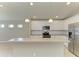 Modern kitchen features white cabinets and stainless steel appliances at 4031 Cottage Hill Ave, Parrish, FL 34219