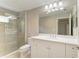Bathroom featuring a glass shower, tiled walls, a modern sink, and a toilet at 4031 Cottage Hill Ave, Parrish, FL 34219