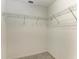 Walk-in closet features carpet flooring and wire shelving at 4031 Cottage Hill Ave, Parrish, FL 34219