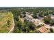 From above, a house near a golf course and walking path, blending outdoor activities with residential comfort at 4219 Berkshire Dr, Sarasota, FL 34241
