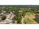 An aerial view of a home bordering a golf course offers peaceful surroundings and recreational opportunities at 4219 Berkshire Dr, Sarasota, FL 34241