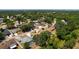 A high angle view shows a home nestled in a neighborhood with mature trees, enhancing its curb appeal at 4219 Berkshire Dr, Sarasota, FL 34241