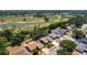 An aerial shot shows a home near a verdant golf course with ponds, highlighting its desirable location at 4219 Berkshire Dr, Sarasota, FL 34241