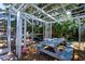 Enclosed pergola with outdoor seating, creating an inviting space for gatherings and relaxation at 4219 Berkshire Dr, Sarasota, FL 34241