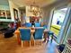 Bright dining room with a wooden table, seating for six, and a view to the back yard at 4219 Berkshire Dr, Sarasota, FL 34241