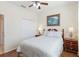 Cozy bedroom features a bed, closet, hardwood floors and two wooden dressers at 4262 70Th Street E Cir, Palmetto, FL 34221