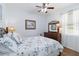 Comfortable bedroom with wood floors, a large dresser, and a bright window at 4262 70Th Street E Cir, Palmetto, FL 34221