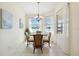 Charming dining area with lake view, a chandelier, and tiled floor at 4262 70Th Street E Cir, Palmetto, FL 34221