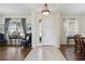 Bright foyer with tile and wood flooring, chandelier lighting, and views into adjacent living spaces at 4262 70Th Street E Cir, Palmetto, FL 34221