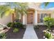 Inviting front entrance with decorative columns, sidelights, and detailed landscaping adding charm at 4262 70Th Street E Cir, Palmetto, FL 34221