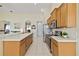 Well-equipped kitchen with modern appliances, white countertops, and ample cabinet space at 4262 70Th Street E Cir, Palmetto, FL 34221
