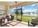 Spacious screened lanai features comfortable seating and views of the lake and lush greenery at 4262 70Th Street E Cir, Palmetto, FL 34221