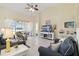 Comfortable living room with tile flooring, comfortable seating, and sliding glass doors to the lanai at 4262 70Th Street E Cir, Palmetto, FL 34221