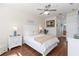 Cozy bedroom boasts wood floors, white furniture, and natural light from the window at 4262 70Th Street E Cir, Palmetto, FL 34221