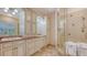 A bathroom with dual sinks and a glass shower at 5024 Commonwealth Dr, Sarasota, FL 34242