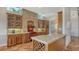 Charming kitchen featuring custom cabinetry, a brick archway over the stove, and terra cotta tile flooring at 5024 Commonwealth Dr, Sarasota, FL 34242