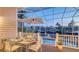 Enclosed lanai with a dining set overlooking the pool and beautiful canal views at 5024 Commonwealth Dr, Sarasota, FL 34242