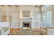 Classic living room with fireplace, built-ins, and exposed beams exudes warmth and charm at 5024 Commonwealth Dr, Sarasota, FL 34242