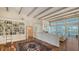 Elegant living room boasts a built-in bookshelf and decorative beams, offering style and function at 5024 Commonwealth Dr, Sarasota, FL 34242