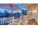 Covered outdoor dining area with waterfront views at 5024 Commonwealth Dr, Sarasota, FL 34242