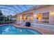 Inviting screened-in pool, lounge chairs, and barbecue, perfect for outdoor entertaining and relaxation at 5024 Commonwealth Dr, Sarasota, FL 34242