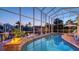 Screened-in pool with waterfront views at 5024 Commonwealth Dr, Sarasota, FL 34242