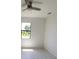 Bright bedroom featuring a ceiling fan and a window offering natural light at 5115 Foxhall Rd, North Port, FL 34288