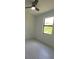 Well-lit bedroom with ceiling fan and a bright window at 5115 Foxhall Rd, North Port, FL 34288