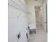 Bright laundry room with white cabinets and sink at 5115 Foxhall Rd, North Port, FL 34288